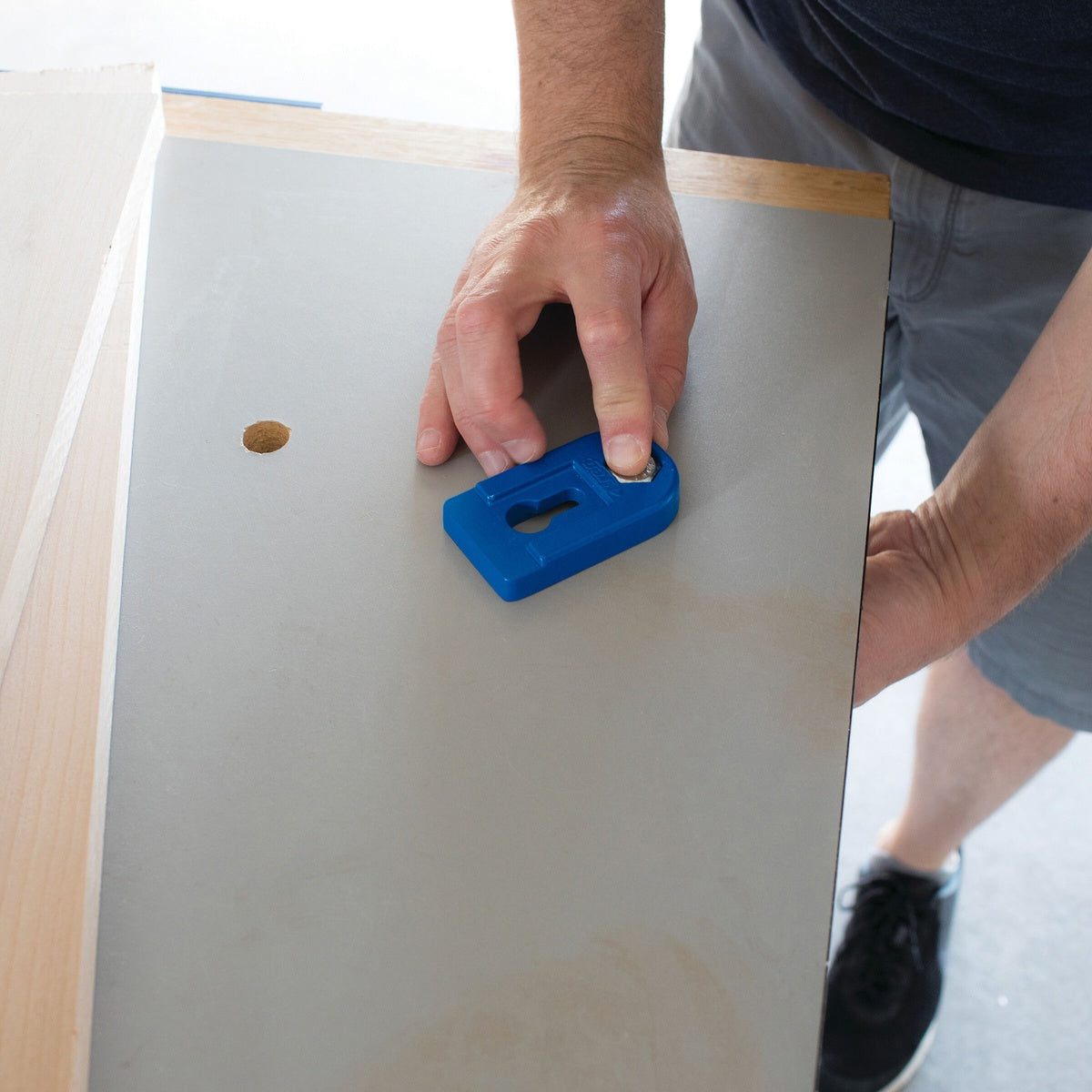 Kreg KBCBA Bench Clamp Base being installed into a work surface for bench clamping on a woodworking setup