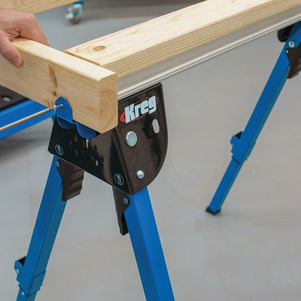 Kreg KWS500 Track Horse sawhorse holding lumber with end support hardware for woodworking in a shop