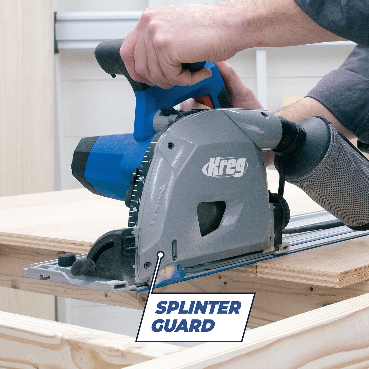 Kreg Tool ACS-SAWBB Adaptive Cutting Plunge-Cut Track Saw, Tool Only making a guided cut through plywood on a workbench with a splinter guard for cleaner sheet-good cutting