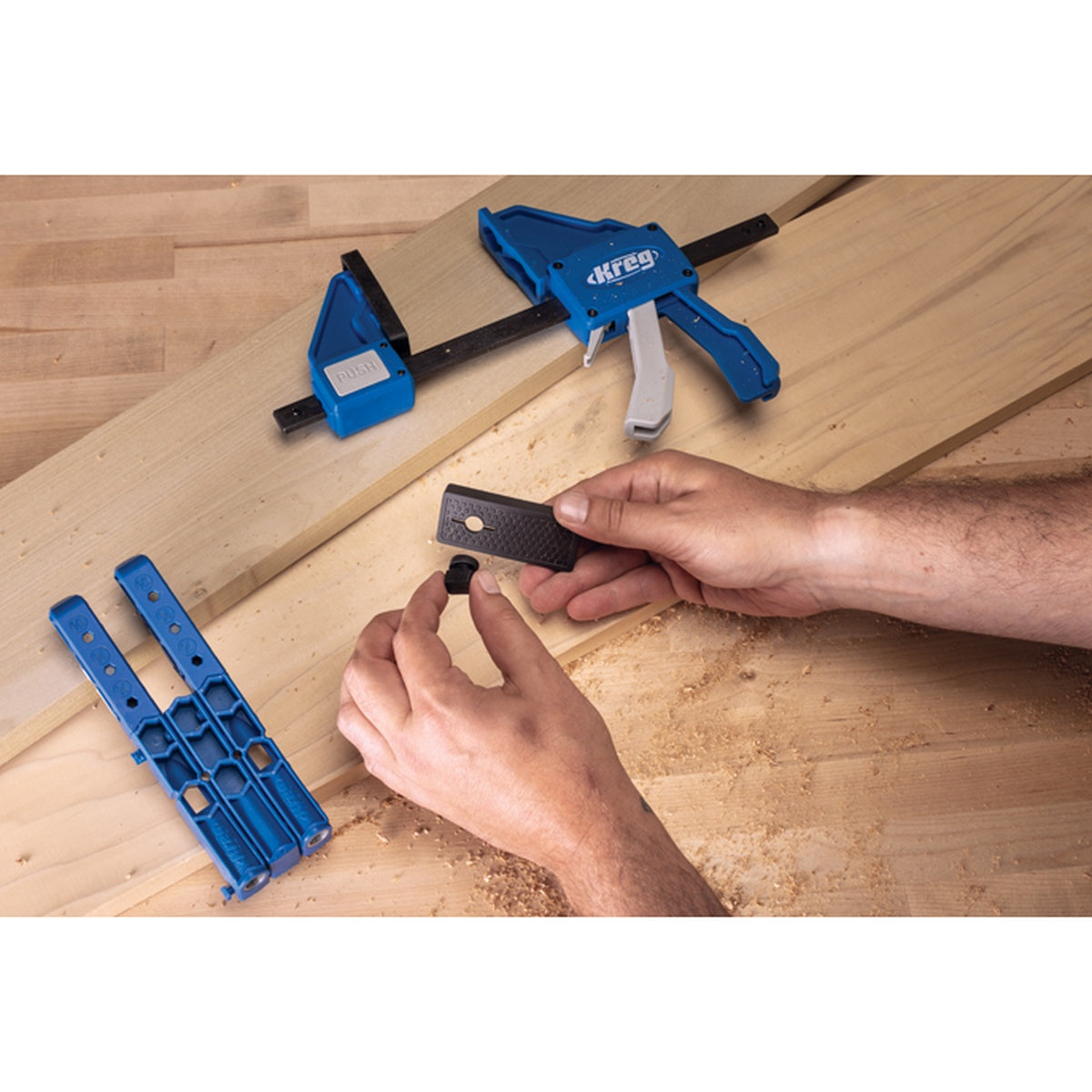 Kreg Tool KVGC36 36 in. VersaGrip Clamp adapter and clamp used on a woodworking bench with Kreg jig accessories