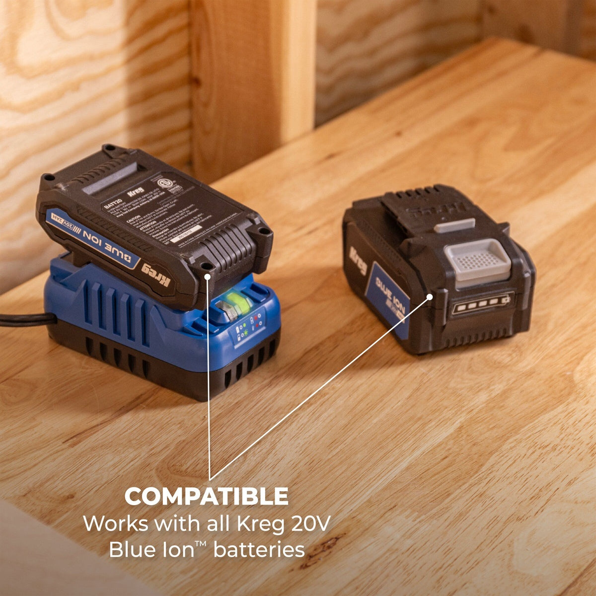 Kreg BCB2A20A 20V Blue Ion Battery and Charger Starter 2.0Ah Kit with battery on charger and LED charge indicators on a workbench