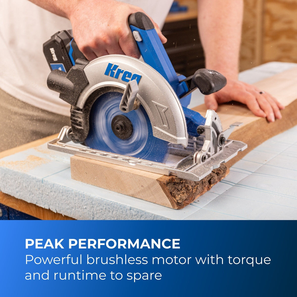 Kreg KPTCS725A 20V Ionic Drive 7-1/4-in Circular Saw making a cut through wood on a workbench during carpentry work