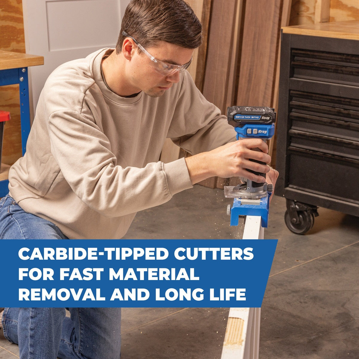 Kreg flush trim router bit cutting a door edge in a woodworking shop with a compact router during trim routing work