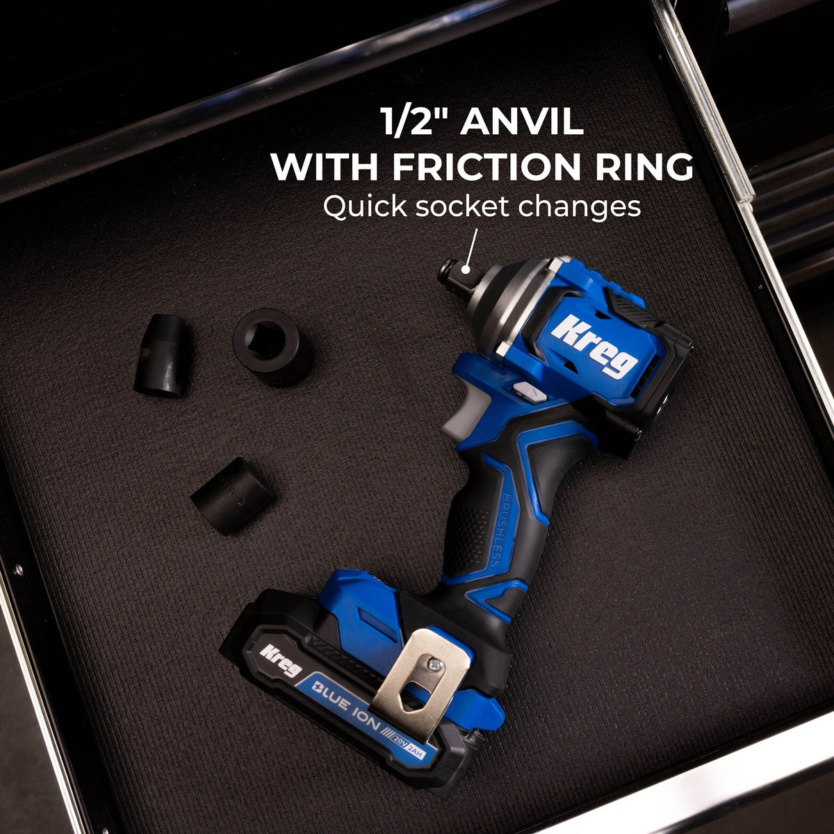 Kreg 20V Ionic Drive 1/2 inch Compact Impact Wrench with 1/2 inch friction ring anvil and impact sockets on a toolbox drawer
