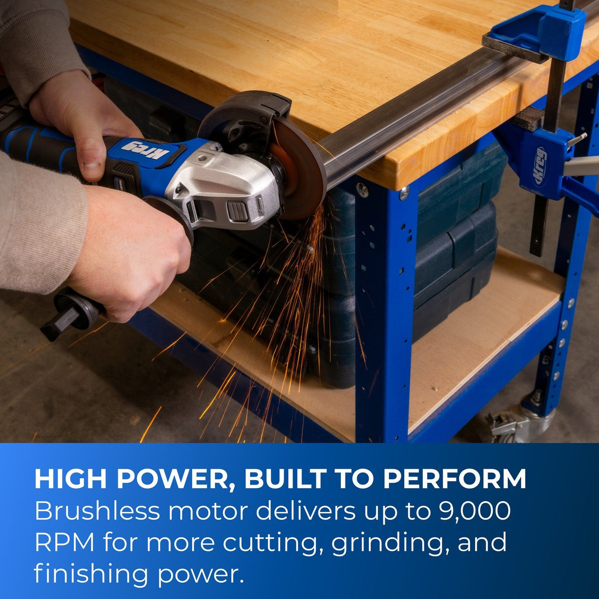 Kreg 20V Ionic Drive 4 1/2-inch to 5-inch angle grinder cutting steel tubing on a workbench in a fabrication shop