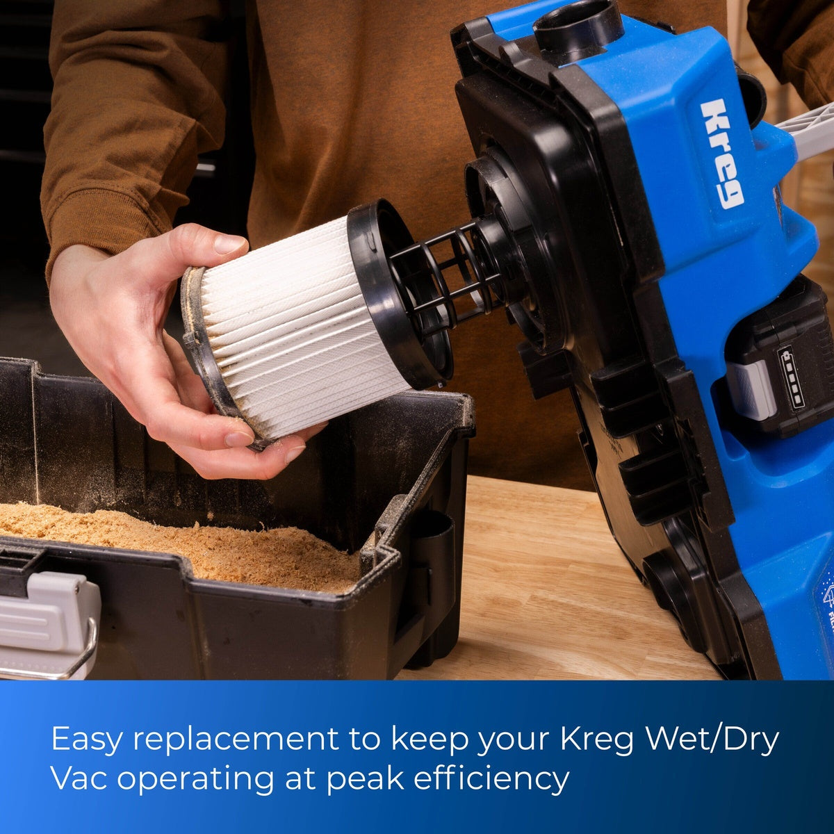 Kreg WDFILTER4 20V Ionic Drive Wet/Dry Vac HEPA Replacement Filter being installed into a cordless wet dry vacuum during sawdust cleanup on a workbench