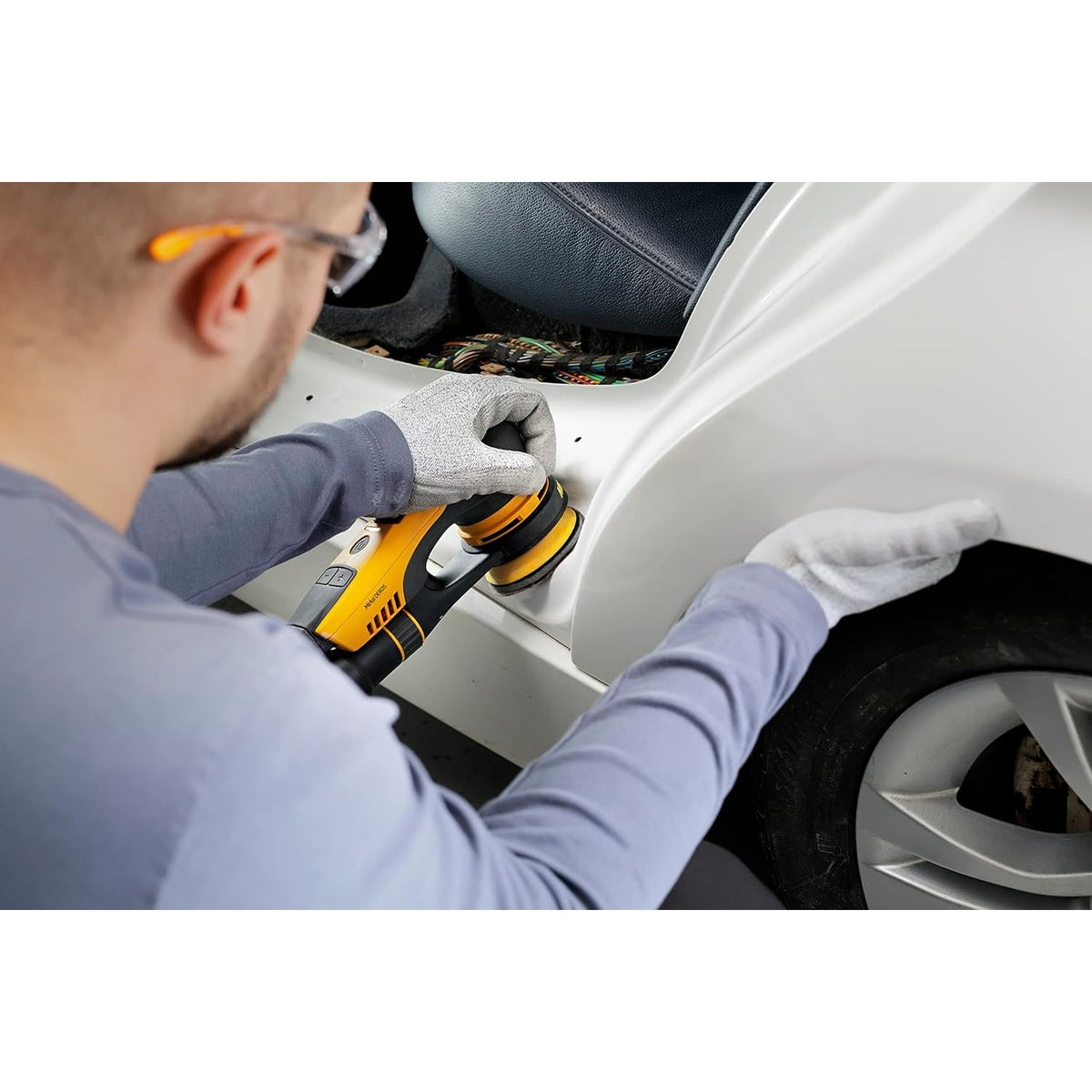 Mirka DEROS random orbital sander in use on automotive body panel