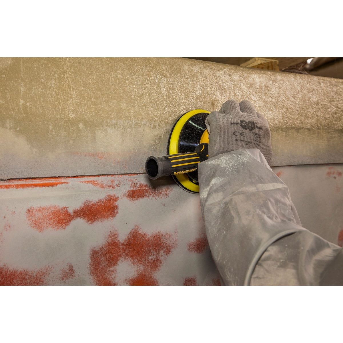 Rear view of Mirka vacuum-ready two-handed orbital sander during sanding