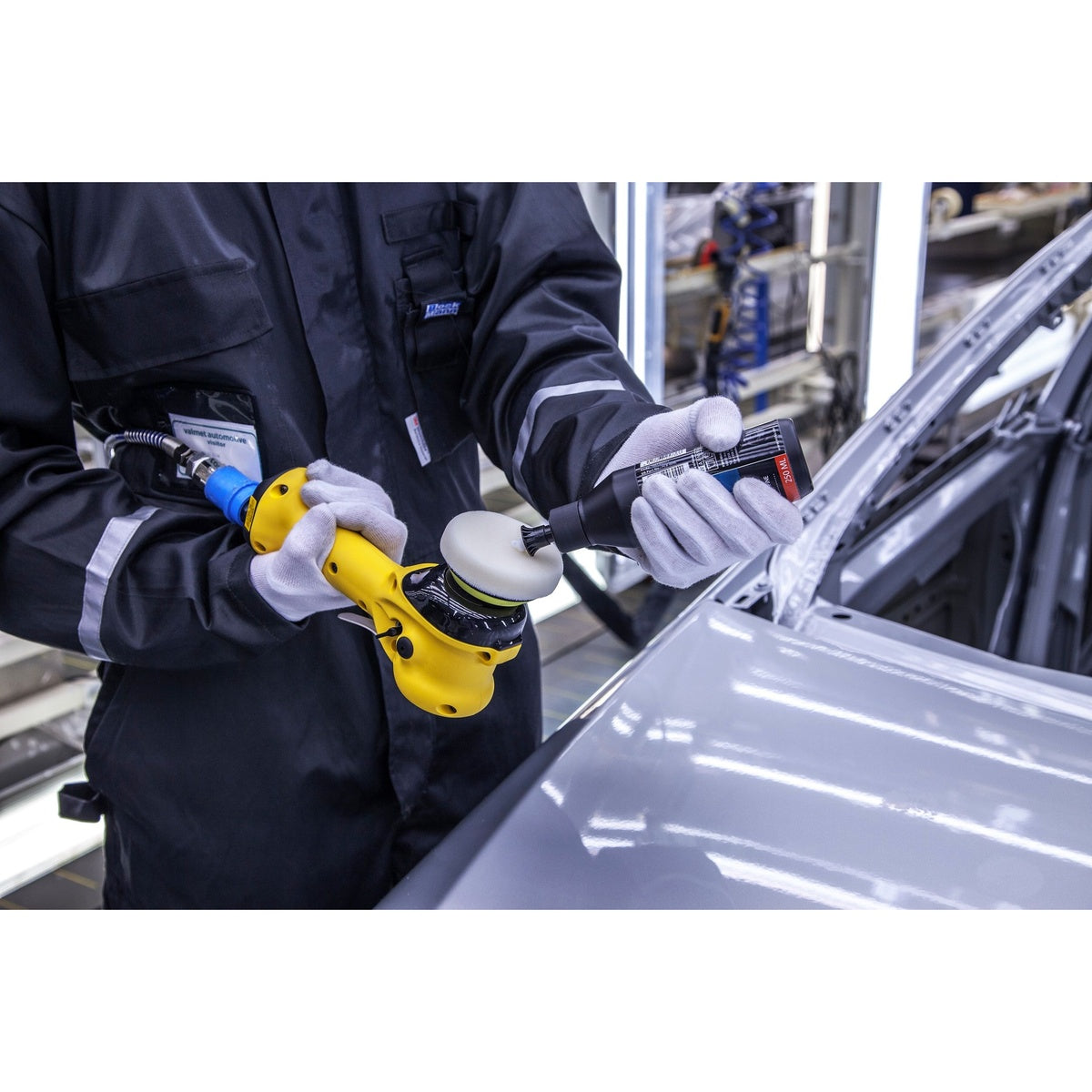 Mirka pneumatic orbital polisher being used on an automotive panel