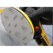 Mirka Gold 6-inch 1500 grit sanding disc attached to a random orbital sander