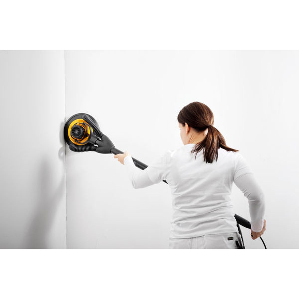 Mirka LEROS wall sander using Mirka net sanding disc on wall