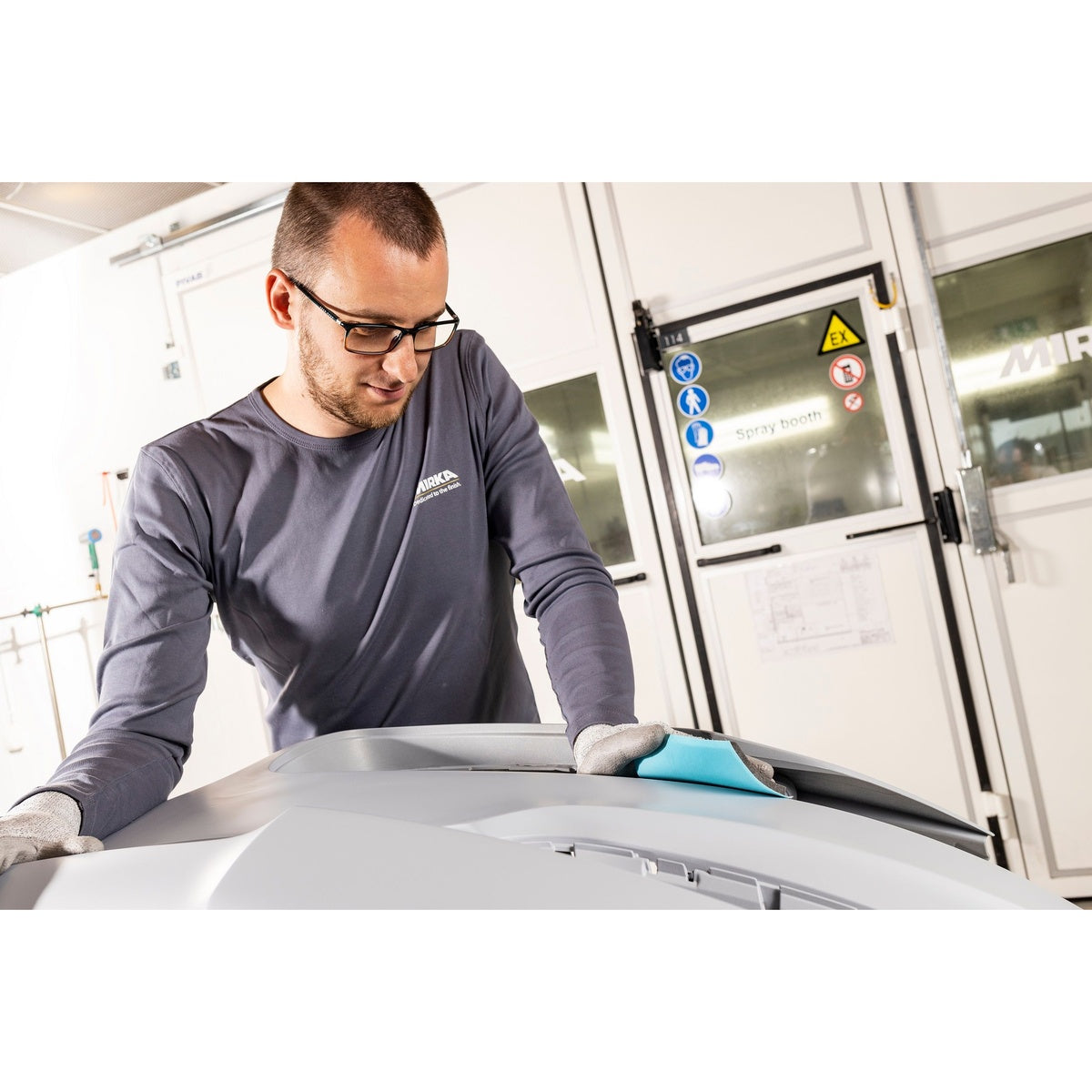 Mirka Novastar Flex sanding sheet used by hand on a contoured automotive panel