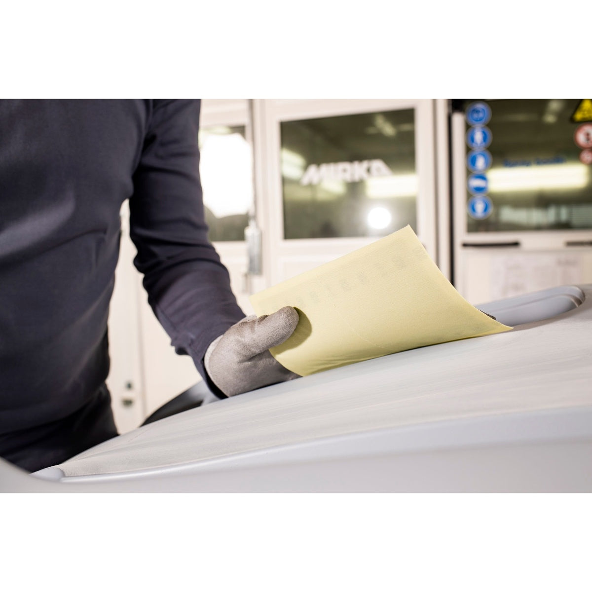 Mirka Novastar Flex sanding sheet used on a vehicle roof surface