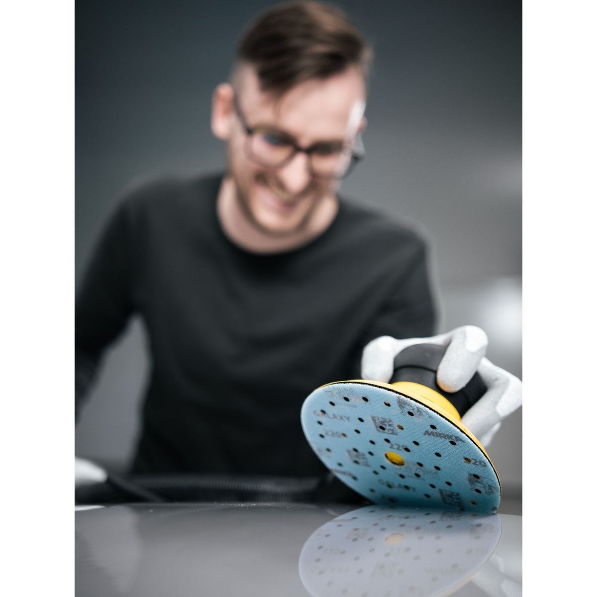 Mirka Galaxy sanding disc on orbital sander in use