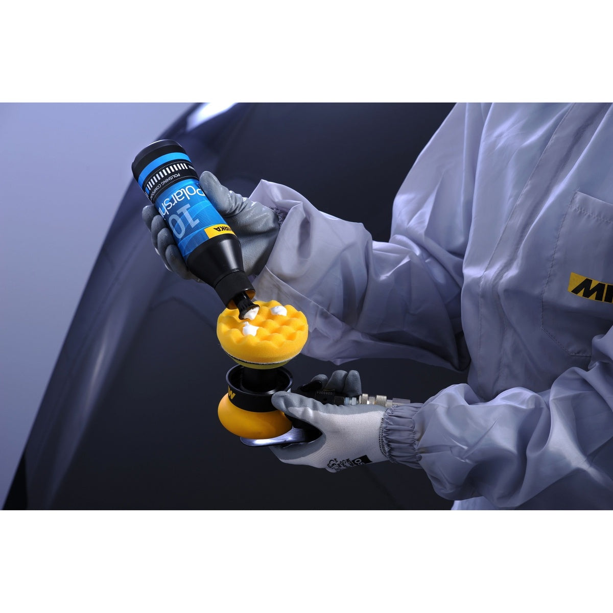 Mirka Polarshine 10 compound being dispensed onto a polishing pad for automotive detailing