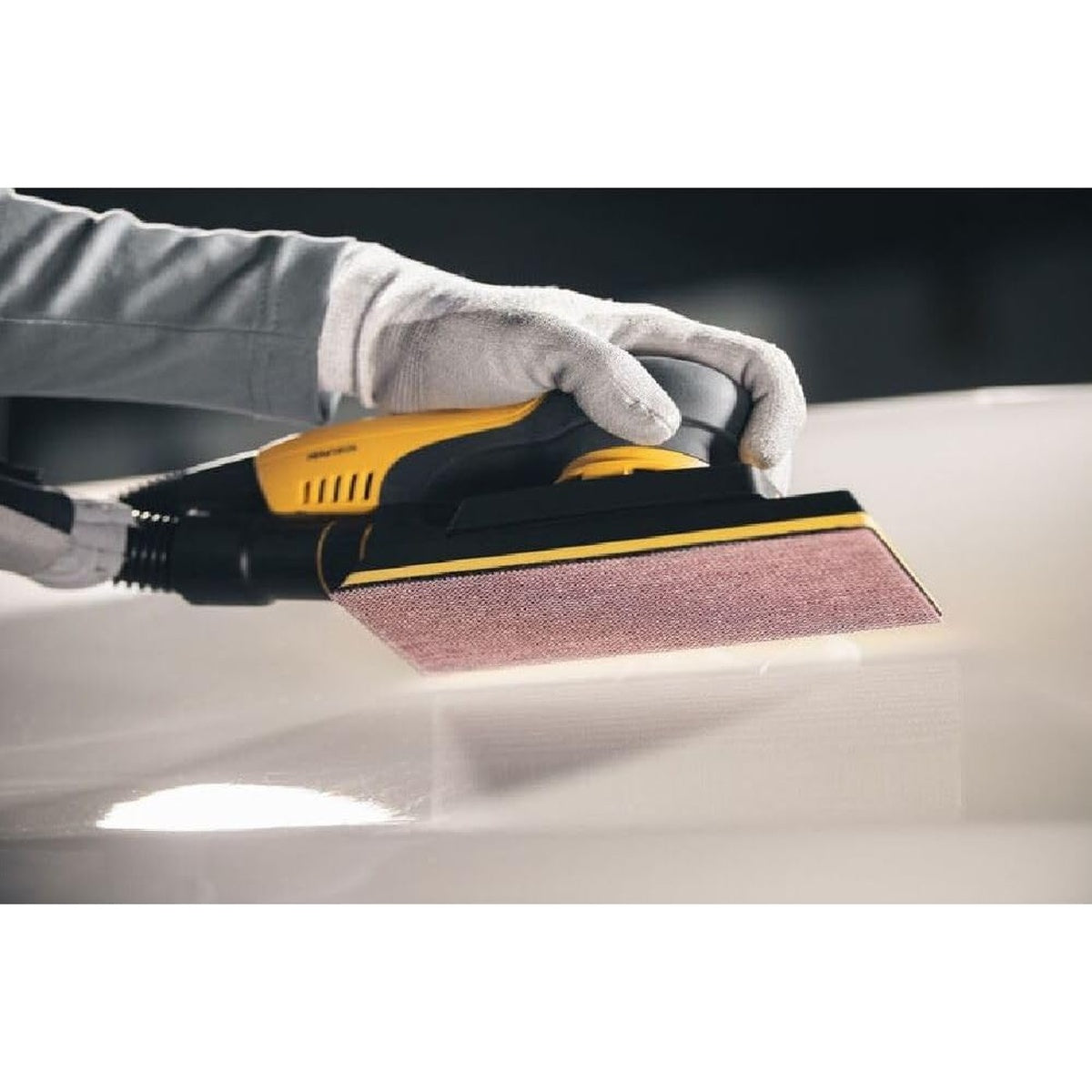 Close-up of Mirka sander with Abranet mesh abrasive sheet