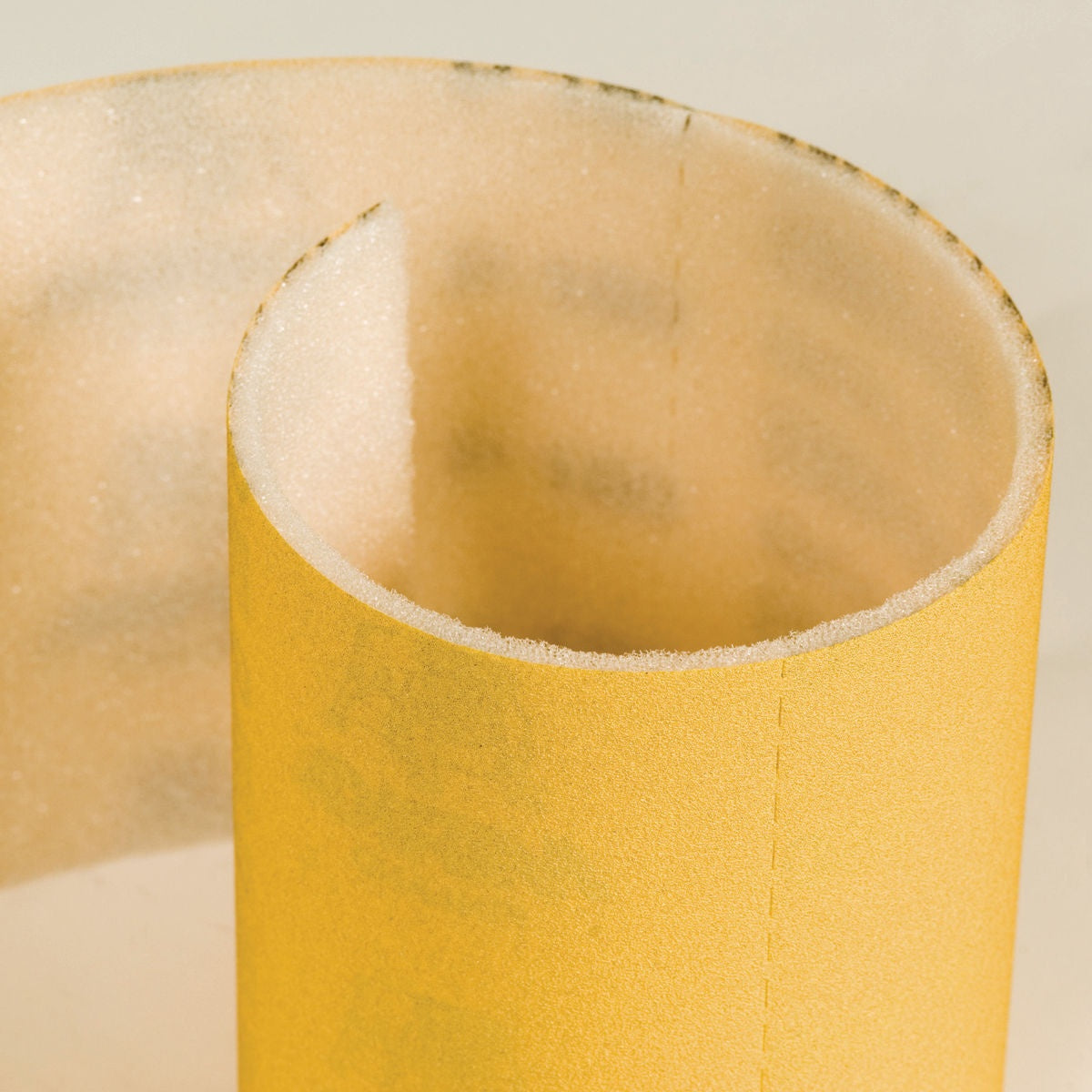 Close-up of Mirka Goldflex Soft foam-backed abrasive material