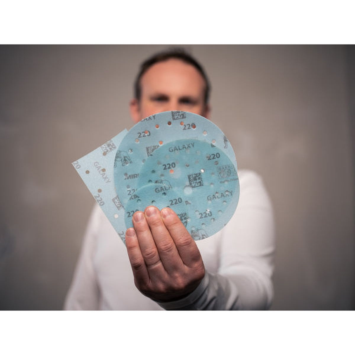 Mirka Galaxy sanding discs shown in hand