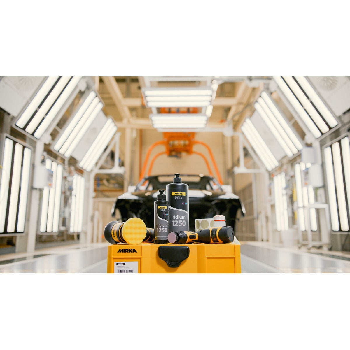 Mirka PRO Iridium polishing compound with polishing tools in auto paint booth