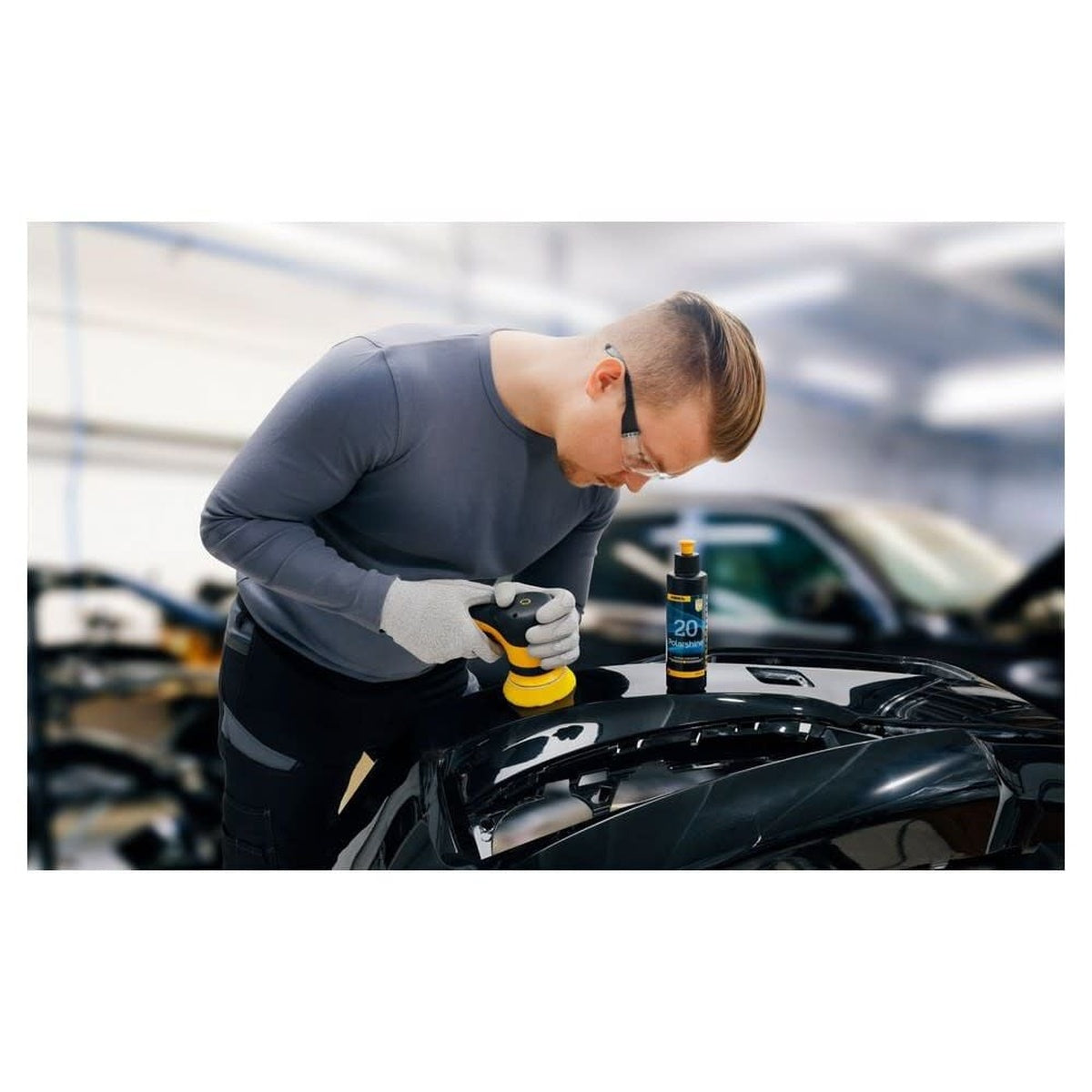 Mirka Polarshine 20 polishing compound being used with a polisher on a black car surface