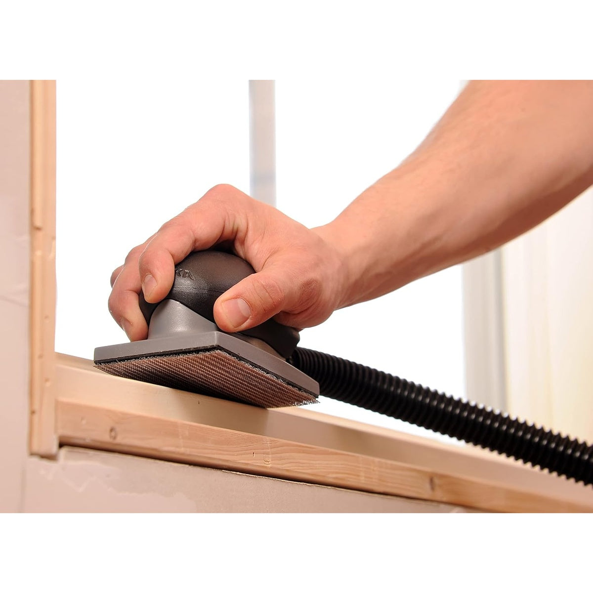 Mirka Abranet sanding sheet attached to a rectangular sander in use