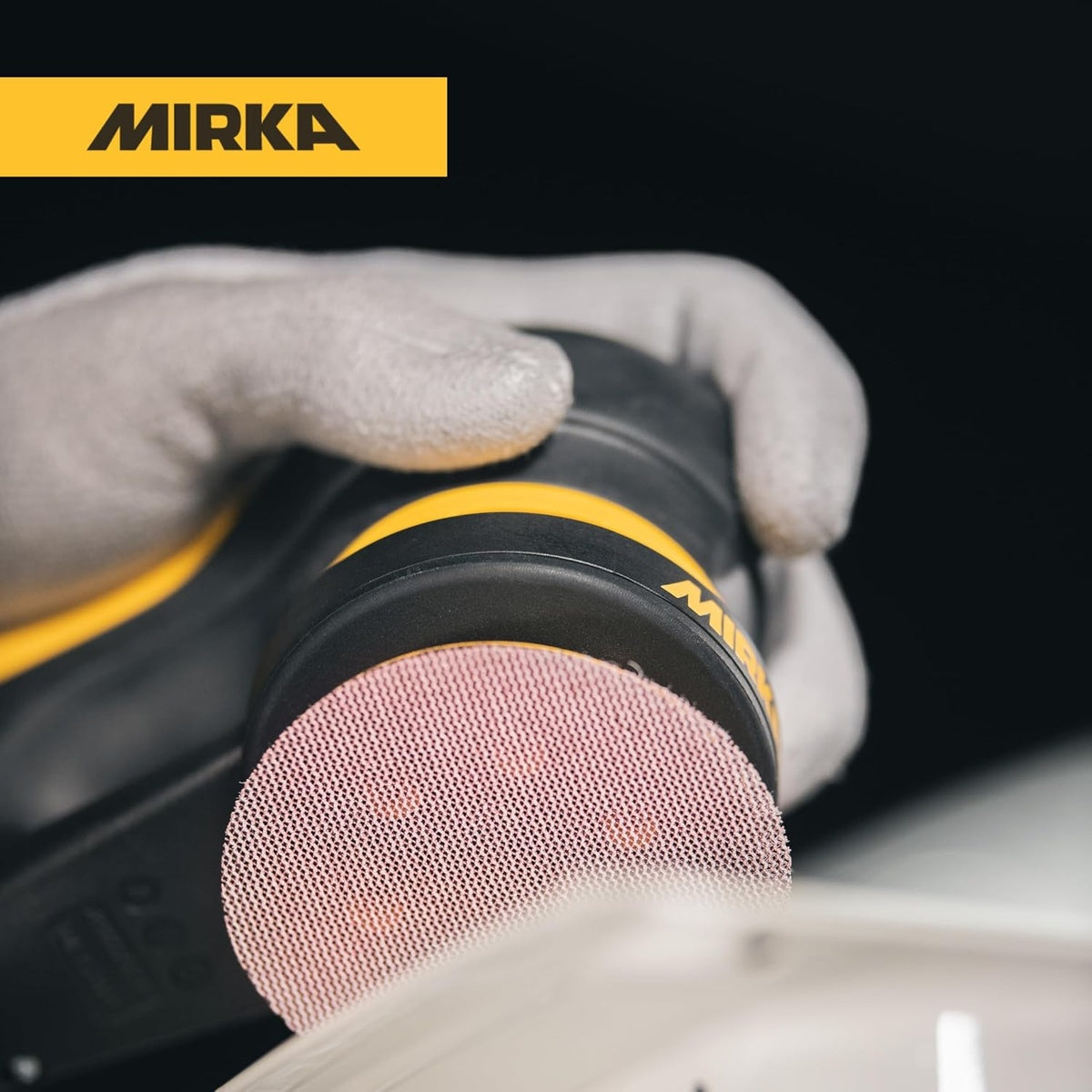 Mirka Abranet 3-in. sanding disc attached to orbital sander