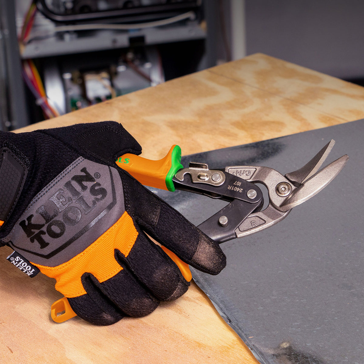 Klein Tools 2403RL right-cut offset aviation snips cutting HVAC sheet metal on the job