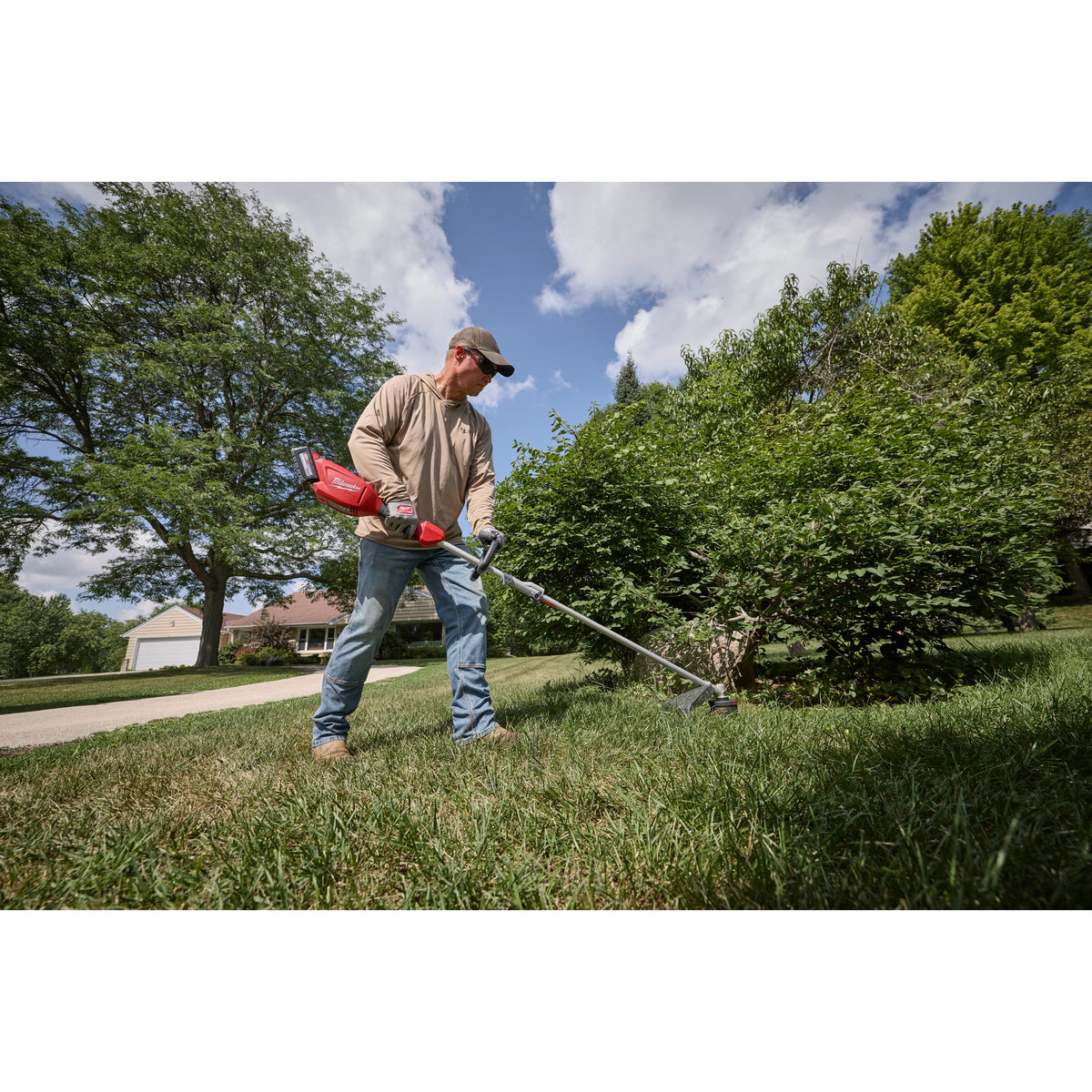 Milwaukee M18 QUIK-LOK Brushless 15-in. String Trimmer 3115-20ST in use outdoors