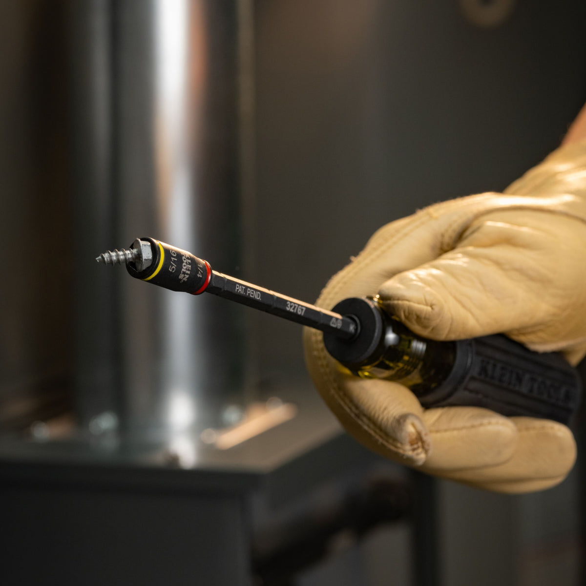 Klein Tools 32767P impact flip socket driving a hex-head screw with an impact driver
