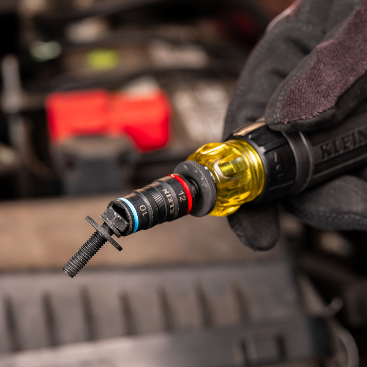 Klein Tools 32941M metric flip socket driving a 10 mm fastener with an impact driver