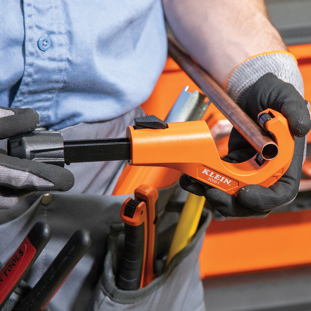 Klein 1-5/8-in. Quick-Adjust Tubing Cutter (50061) in use on a jobsite