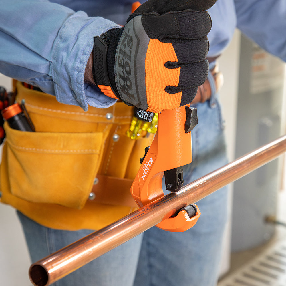 Klein 1-5/8-in. Quick-Adjust Tubing Cutter (50061) in use on copper tubing