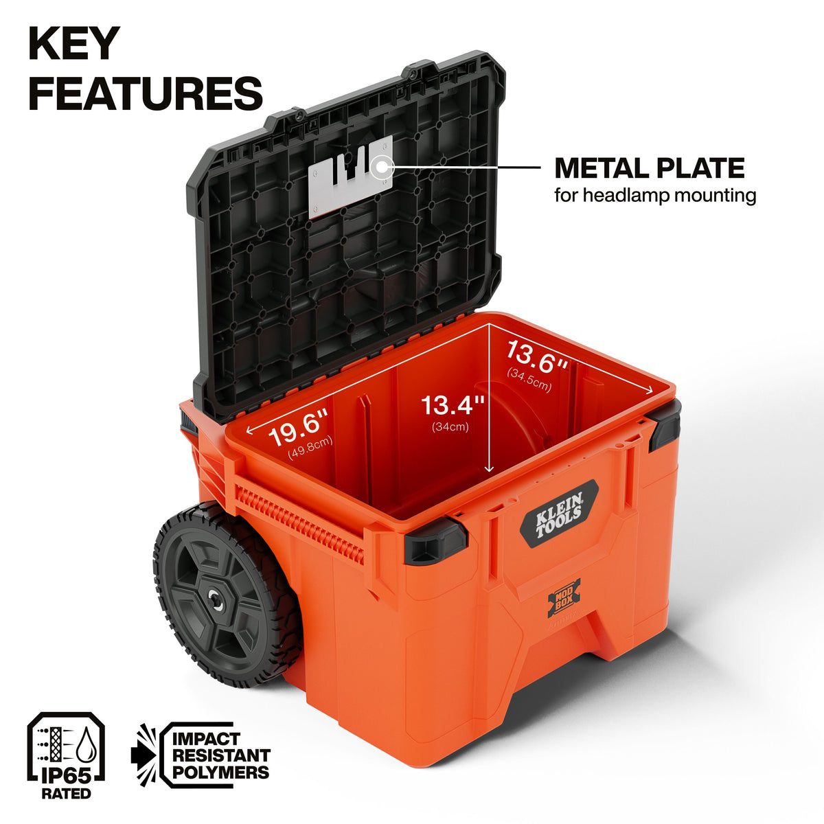 Klein Tools 54100MBX 10-inch solid rubber wheels and removable telescoping handle on rough terrain