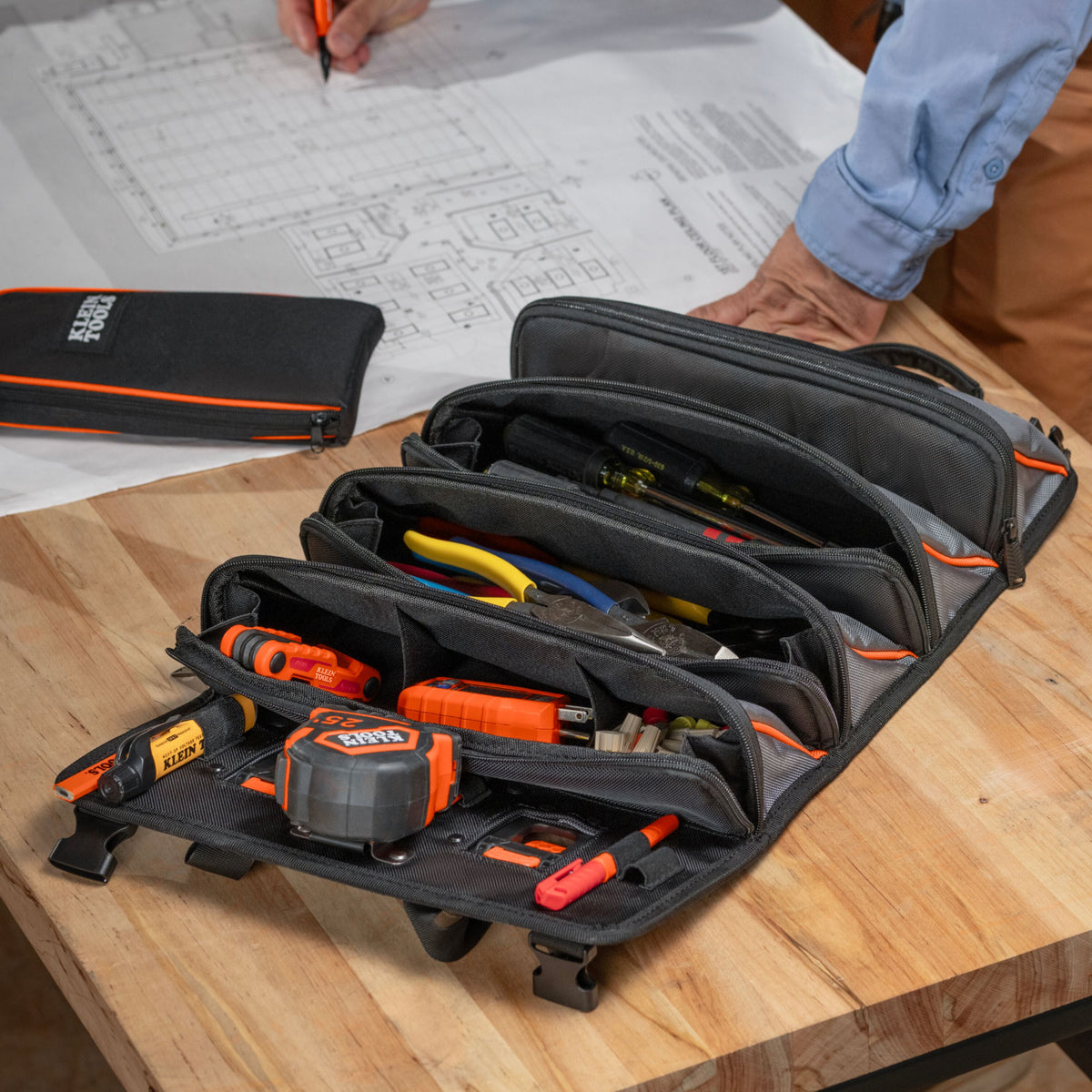 Klein Tools 54309MB MODbox roll up pouch mounted on a MODbox utility cart rail on the jobsite