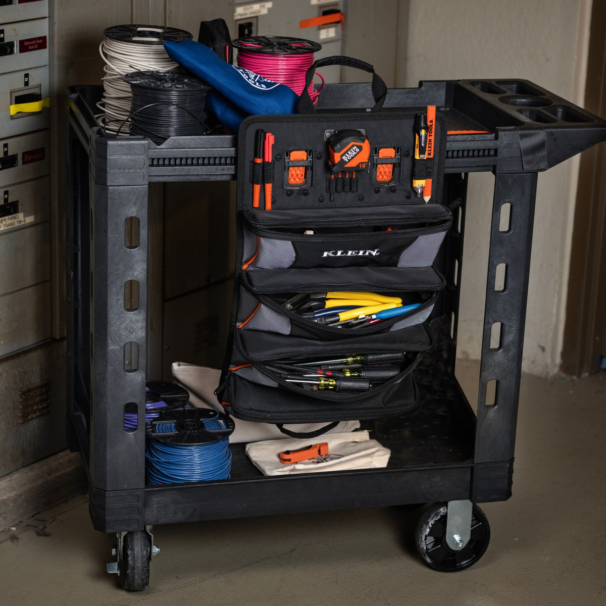 Klein Tools 54309MB MODbox pouch organizing hand tools on the side of a utility cart