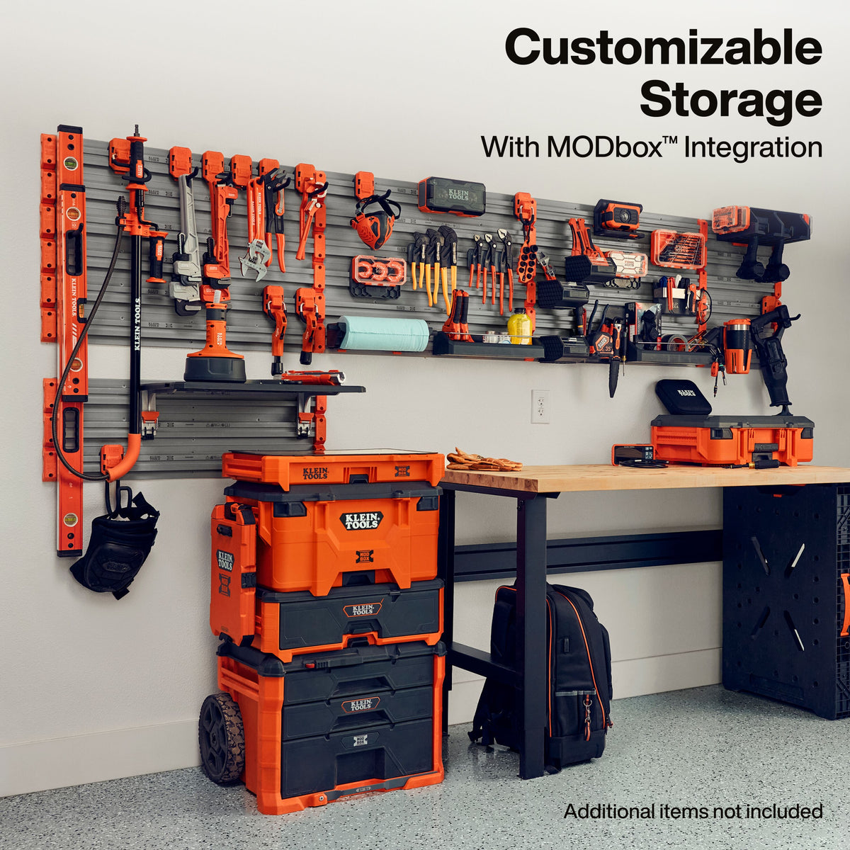 Klein Tools MODbox Wall System 32-Inch Panel 2-Pack (54854MB) holding power tools and accessories in a shop