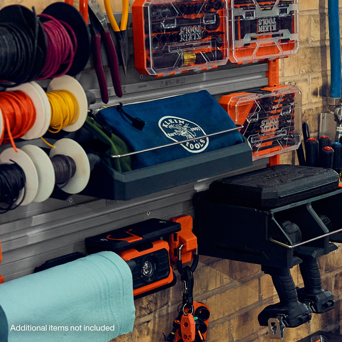 Klein Tools MODbox Wall System Narrow Shelf (54863MB) storing everyday essentials in a jobsite trailer