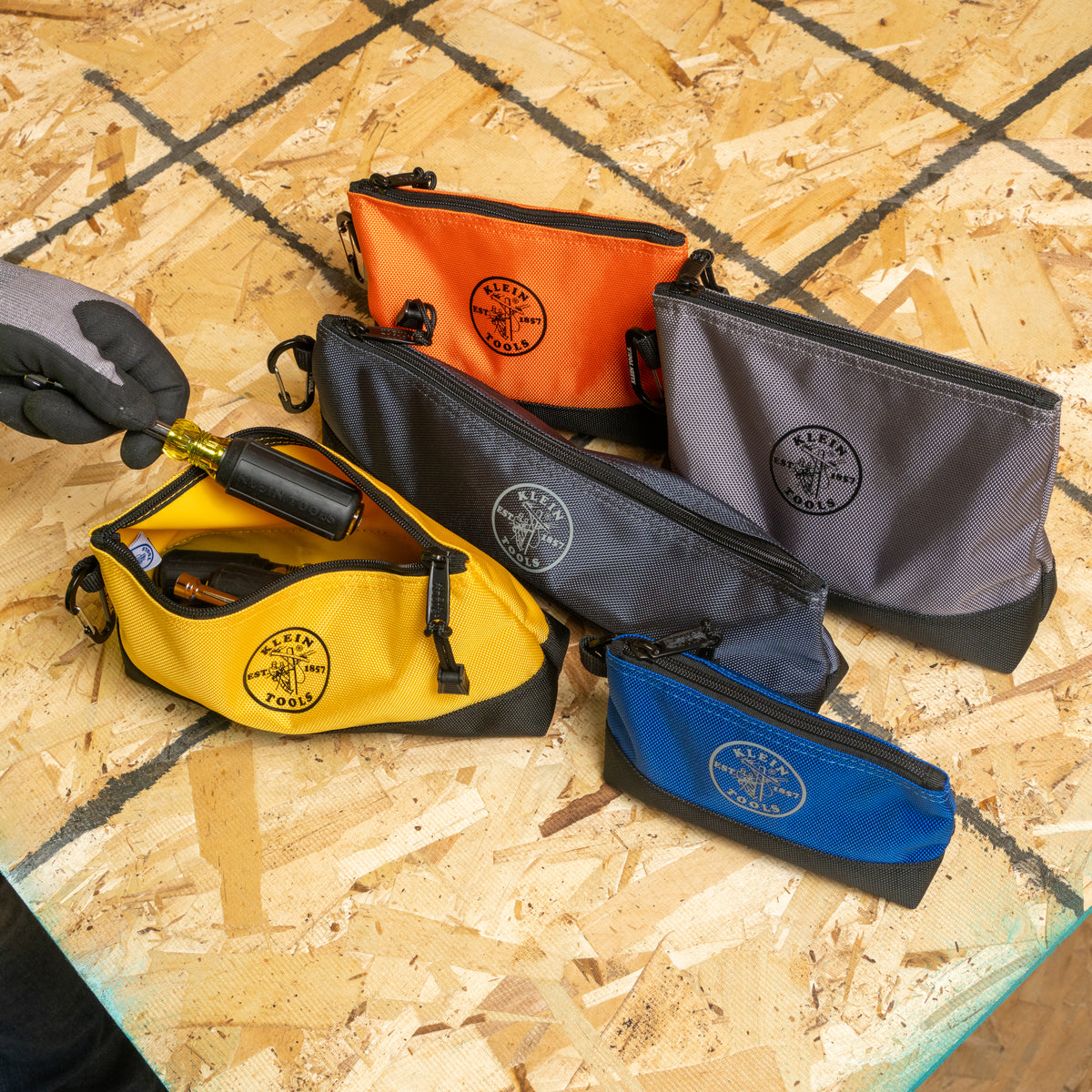 Klein stand-up zipper bag clipped to a tool bag with carabiner