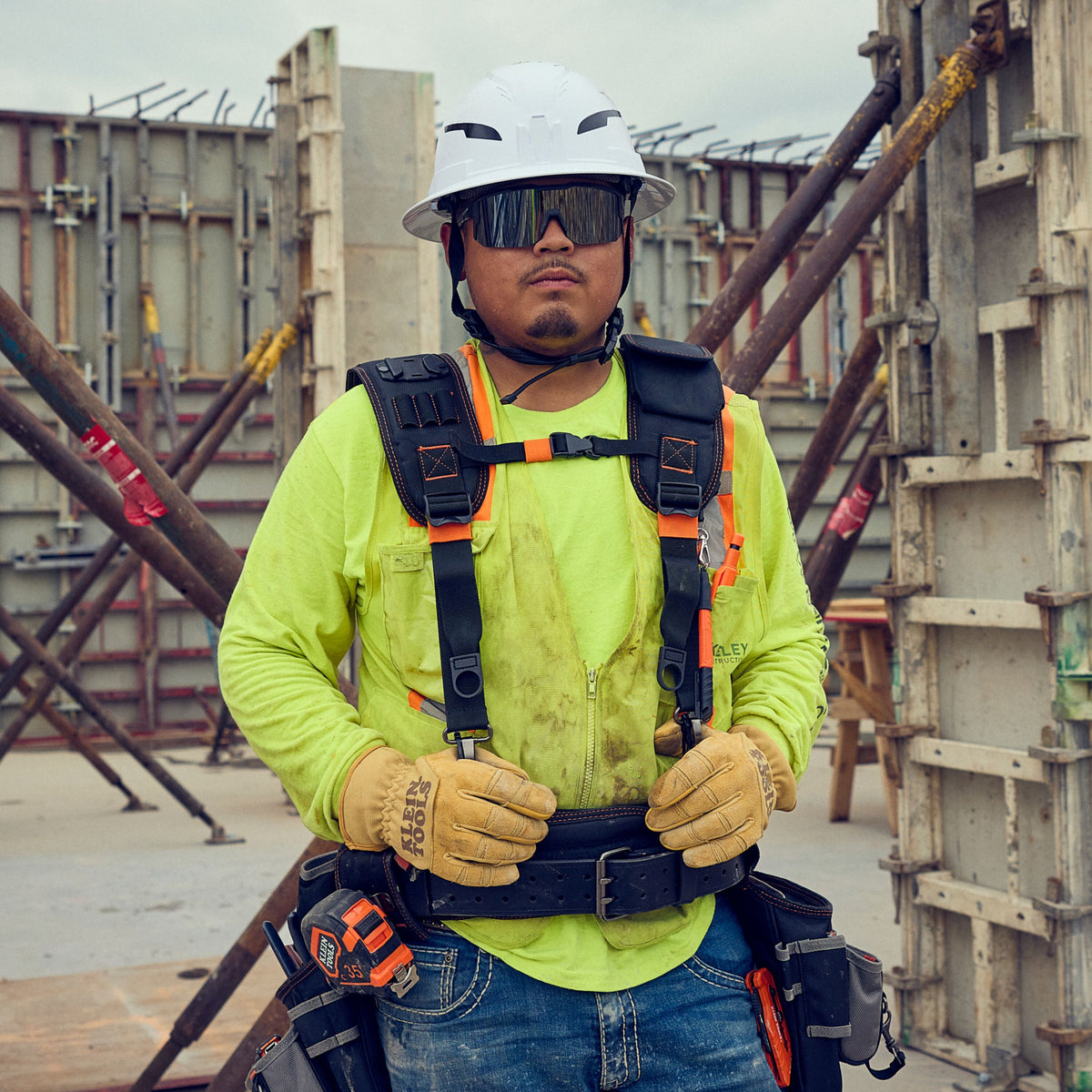 Klein Tools 55896 tool belt with suspenders worn on the jobsite