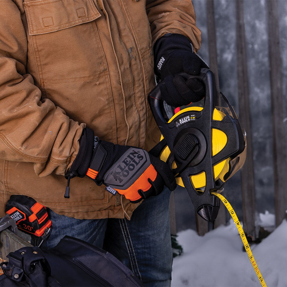Klein heated glove liners worn under work gloves in cold weather