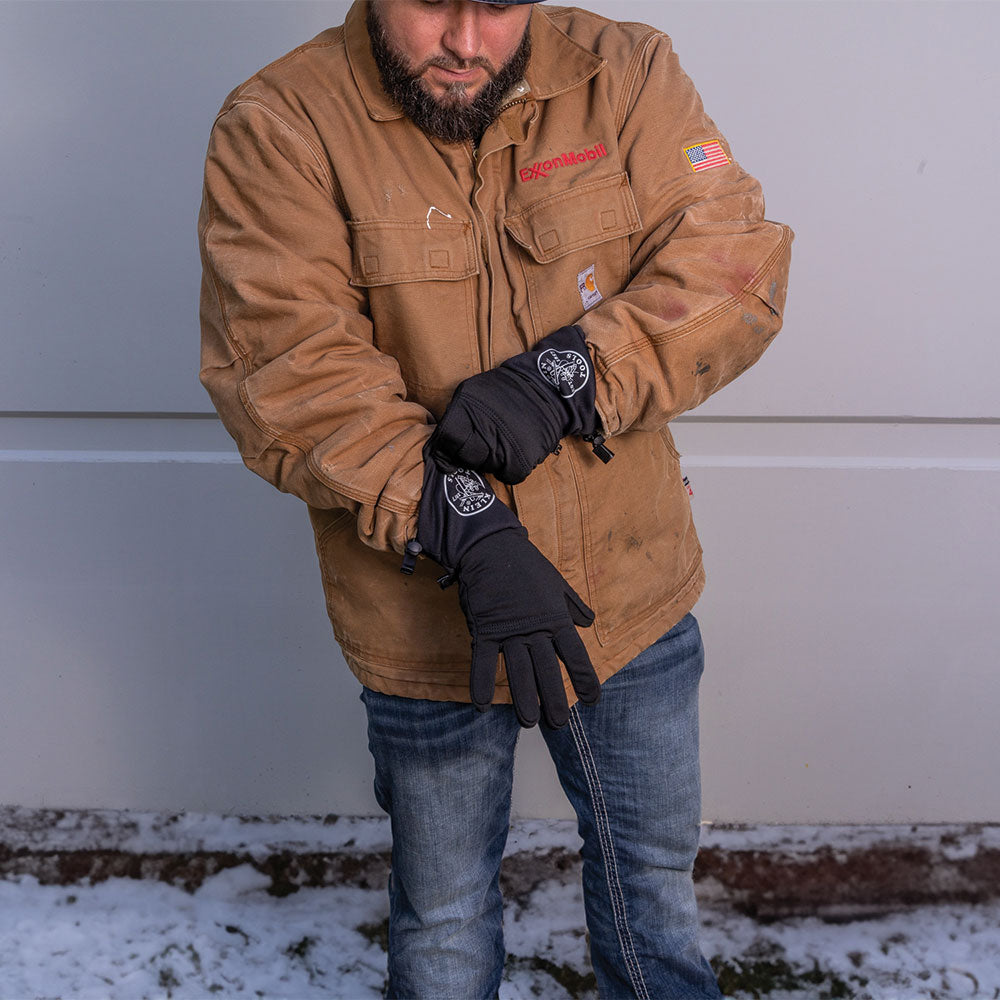 Klein heated glove liners in use outdoors