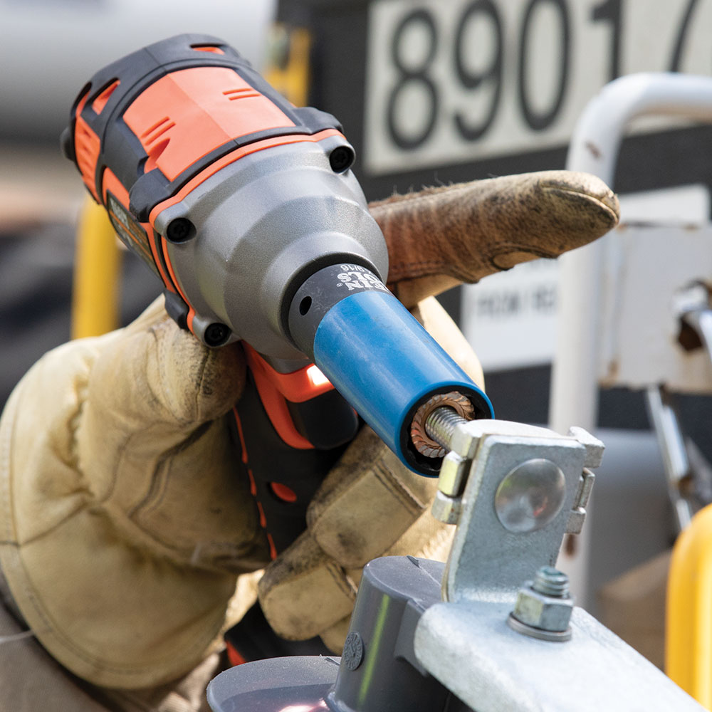 Klein 66030 coated impact socket driving a nut on a utility pole
