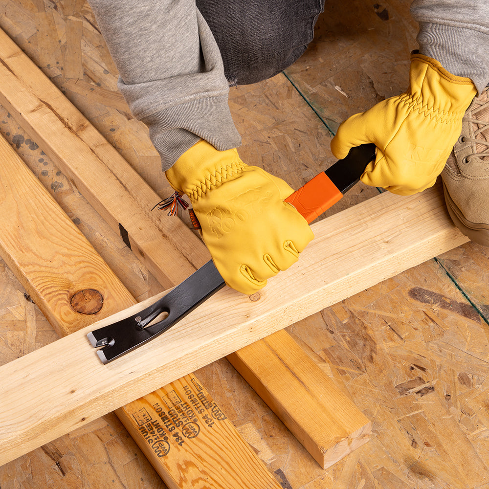 Klein 15-in. heavy-duty pry bar prying trim on a jobsite