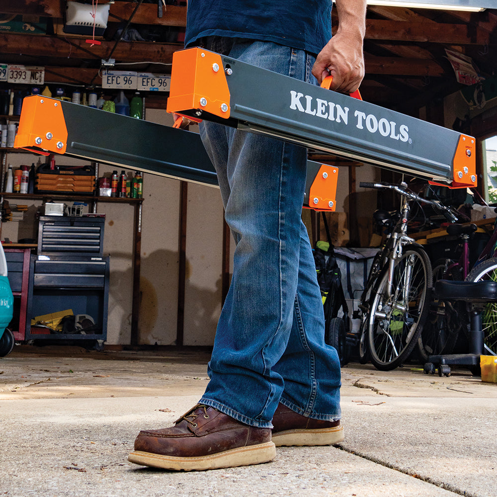 Klein fixed-leg sawhorses supporting lumber on a jobsite