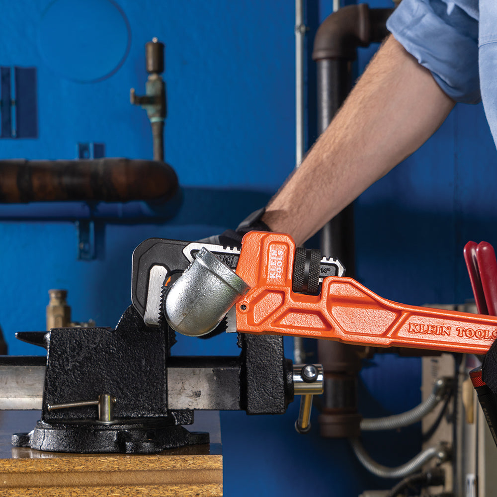 Klein 14-in. cast iron pipe wrench turning pipe