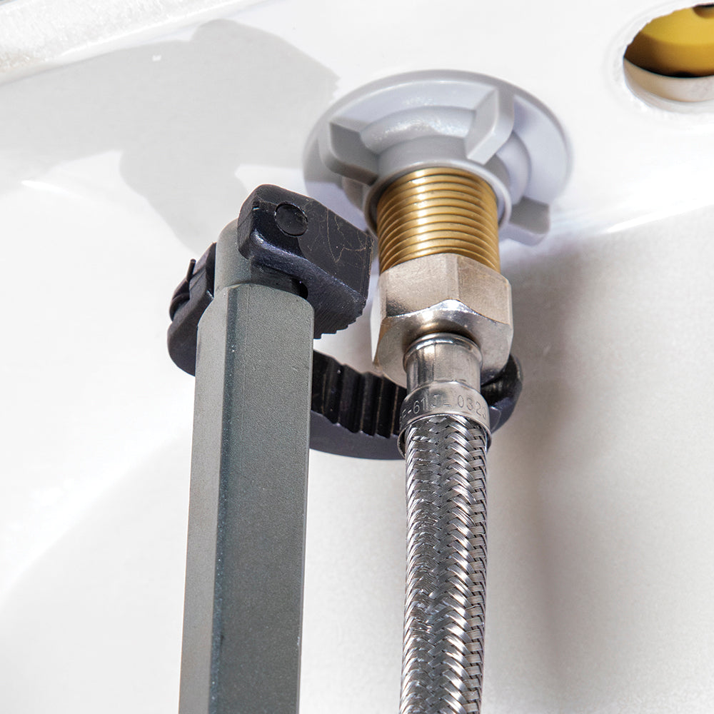 Klein telescoping basin wrench on a faucet supply connection