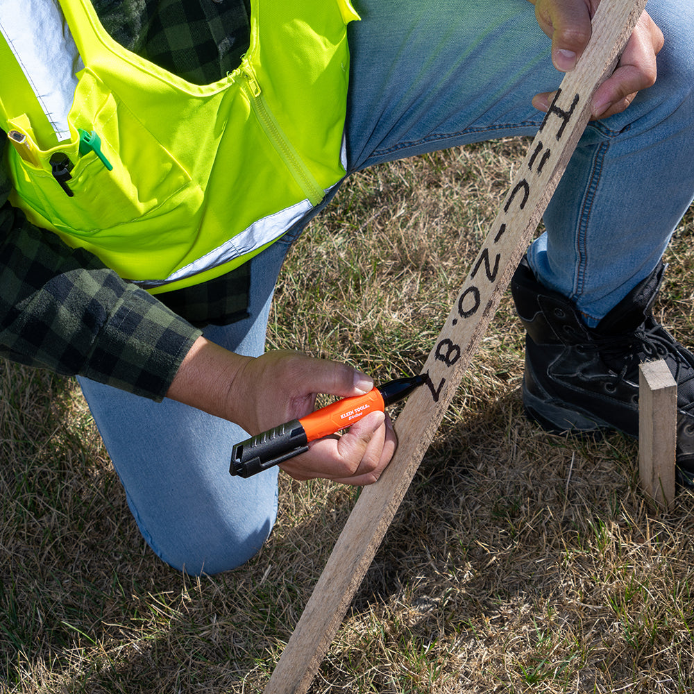 Klein Skribes black chisel-tip permanent marker marking a jobsite surface