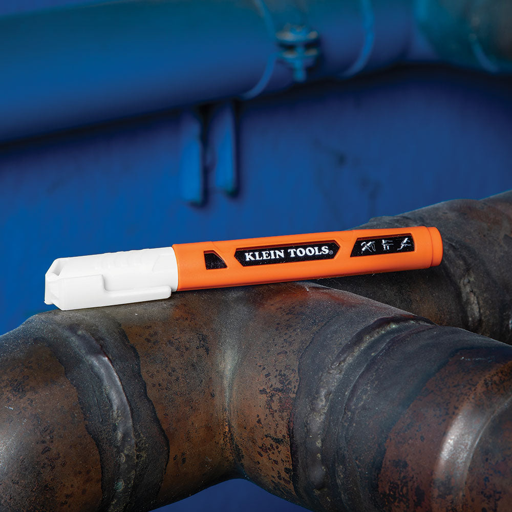 Klein Skribes white paint marker in use on a jobsite