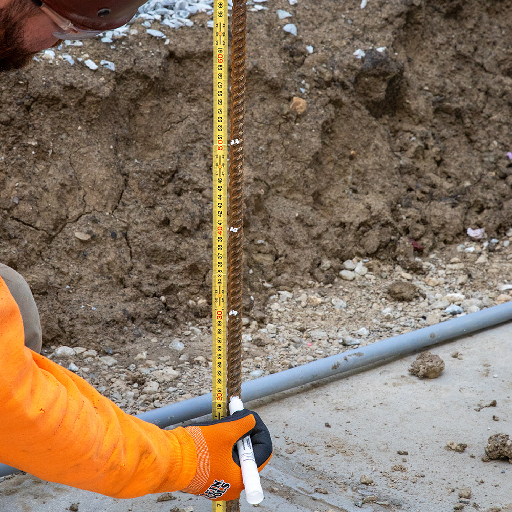 Klein metric folding ruler measuring on a jobsite