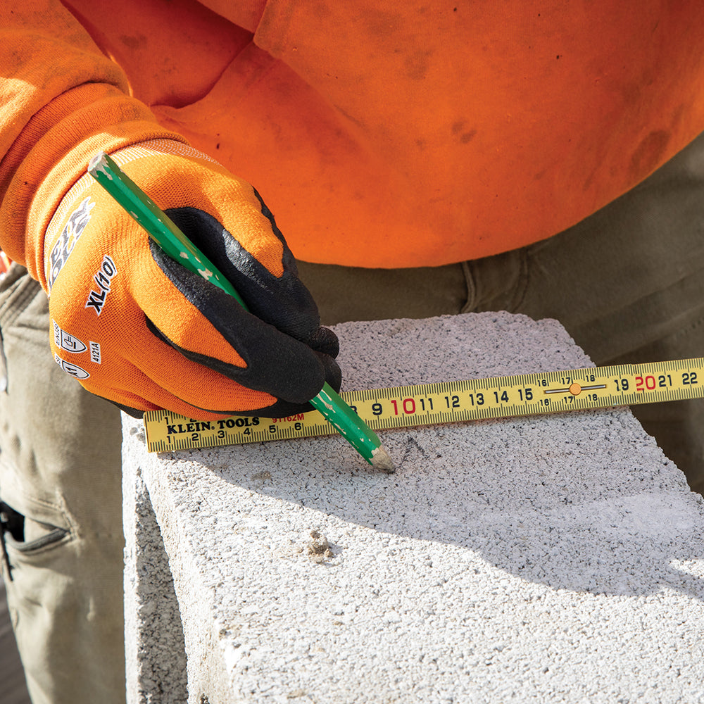 Klein metric folding ruler laying out a measurement